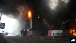 A building burns after shelling in Kyiv, Ukraine, March 3, 2022. 