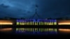 Australia’s Parliament House is seen illuminated with the colors of Ukraine's flag in solidarity with the country's people and government after Russia's invasion of Ukraine, in Canberra, Australia, Feb. 28, 2022.