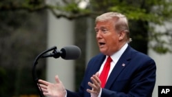 President Donald Trump speaks about the coronavirus in the Rose Garden of the White House, in Washington, April 14, 2020.