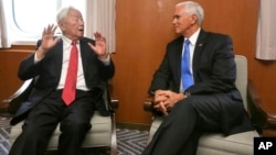 In this photo released by Taiwan's Ministry of Foreign Affairs, Taiwan's special APEC envoy Morris Chang, left, meets with U.S. Vice President Mike Pence on the Pacific Explorer cruise ship on the sidelines of the APEC Summit, Nov. 17, 2018, in Port Moresby, Papua New Guinea. 