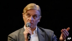 FILE - Oleg Tinkov speaks to the media during a Tinkoff-Saxo cycling team press conference in London, May 28, 2010.