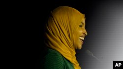 U.S. Representative Ilhan Omar speaks to a crowd early morning Wednesday in St. Paul, Minnesota, after winning re-election to represent Minnesota’s 5th district. She is the most prominent of several Somali-American candidates to win on election night.