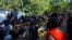Sri Lankan university students push down police barricades during a protest over the country’s worst economic crisis in decades outside the residence of prime minister Mahinda Rajapaksa in Colombo, Sri Lanka, April 24, 2022.