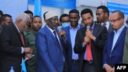 Somalia's newly elected upper house parliament speaker Adan Nuur Madobe, center, is seen after being elected at the airport complex in Mogadishu on April 28, 2022. 