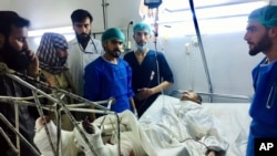A wounded man receives treatment in a hospital, after a bombing in Mazar-e-Sharif, northern Afghanistan, April 28, 2022. Two explosions came within minutes of each other.