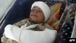 FILE - A wounded child injured in an explosion at Imam Sahib district, north of Kunduz city, receives treatment at a hospital in Kunduz province on April 22, 2022.
