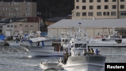 A fishing boat leaves from Utoro port for searching for the missing tour boat Kazu 1 in Shari, Hokkaido Prefecture, Japan, in this photo taken by Kyodo on April 24, 2022.