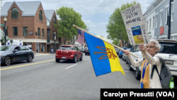 Sophia LaFountaine of Rosslyn, Virginia, is protesting outside the Ukrainian embassy, April 27, 2022.