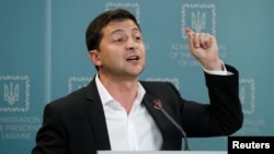 FILE - Ukrainian President Volodymyr Zelenskiy speaks to media during his press conference in Kyiv, Ukraine, Oct. 1, 2019. 