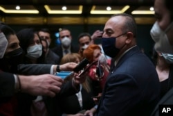FILE - Turkish Foreign Minister Mevlut Cavusoglu speaks to the media in Ankara, Turkey, March 9, 2022.