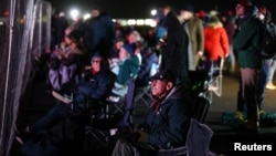 Spectators gather at Cornwall Airport Newquay to watch the first ever U.K. launch of Virgin Orbit's LauncherOne rocket from Spaceport Cornwall in Newquay, Britain, Jan. 9, 2023.