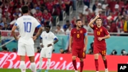 Carlos Soler, right, celebrates Spain's sixth goal during the World Cup group E soccer match between Spain and Costa Rica, at the Al Thumama Stadium in Doha, Qatar, Nov. 23, 2022. Spain won 7-0.