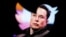 FILE - Elon Musk's photo is seen through a Twitter logo in this illustration created Oct. 28, 2022. As of Dec. 21, 2022, Musk was seeking a new leader to run the social media network.