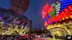 Casino Lisboa, right, is seen in Macao on Dec. 28, 2022. (AP Photo/Kanis Leung)