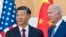 FILE - U.S. President Joe Biden, right, stands with Chinese President Xi Jinping before a meeting on the sidelines of the G-20 summit meeting in Bali, Indonesia, Nov. 14, 2022. 