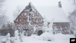 A winter storm rolls through western New York, Dec. 24, 2022, in Amherst, NY. 