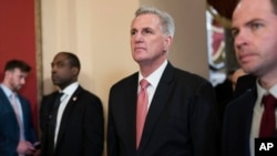 Rep. Kevin McCarthy, R-Calif., talks to reporters as he walks to the House chamber as the House meets for the third day to elect a speaker and convene the 118th Congress in Washington, Jan. 5, 2023. 