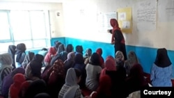Girls barred from education by Taliban study in a secret school run by volunteers in Afghanistan. (Photo courtesy Parasto)