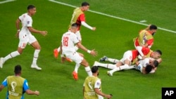 Morocco's Zakaria Aboukhlal celebrates with his teammates after scoring his side's second goal during the World Cup group F soccer match between Belgium and Morocco, at the Al Thumama Stadium in Doha, Qatar, Nov. 27, 2022.