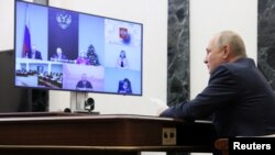 俄罗斯总统普京在莫斯科通过视频举行总统公民社会发展与人权委员会的年度会议。(2022年12月7日)