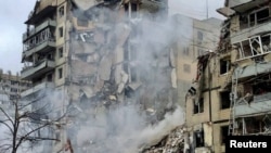 A view shows an apartment building heavily damaged by a Russian missile strike, amid Russia's attack on Ukraine, in Dnipro, Ukraine January 14, 2022. 