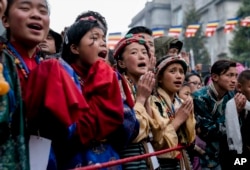 Tibetan devotees greet their spiritual leader the Dalai Lama as he arrives at the Thubchok Gatsel Ling Monastery in Bomdila, Arunachal Pradesh, India, April 4, 2017.