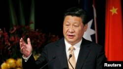 FILE - China's President Xi Jinping addresses the Australia-China state and provincial leaders forum in Sydney, Nov. 19, 2014. 