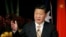FILE - China's President Xi Jinping addresses the Australia-China state and provincial leaders forum in Sydney, Nov. 19, 2014. 