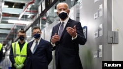U.S. President Joe Biden speaks as he tours a Pfizer manufacturing plant producing the coronavirus disease (COVID-19) vaccine in Kalamazoo, Michigan, Feb. 19, 2021.