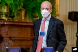 FILE - Chair of the Securities and Exchange Commission Gary Gensler arrives for a meeting in the East Room of the White House, Jan. 24, 2022.