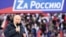 Russian President Vladimir Putin delivers a speech during a rally at Luzhniki Stadium in Moscow, March 18, 2022. The banner reads: "For Russia," using the untraditional "Z" representative of Russia's campaign in Ukraine. (Sputnik/Kremlin via Reuters)
