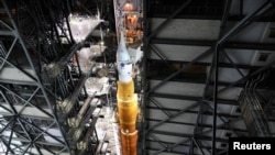 NASA's next-generation moon rocket, the Space Launch System rocket with its Orion crew capsule perched on top, March 16, 2022.
