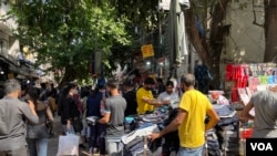  As a third wave of the pandemic wanes in India, markets in New Delhi are again crowded. 