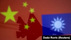 Chinese and Taiwanese national flags are displayed alongside a military airplane in this illustration taken April 9, 2021. (Reuters/Dado Ruvic)