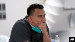 Medical student Diego Montelongo pauses after a patient died inside the Coronavirus Unit at United Memorial Medical Center, July 6, 2020, in Houston.