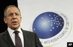 Russia's Foreign Minister Sergei Lavrov holds a news conference after a NATO-Russia foreign ministers meeting at the Alliance headquarters in Brussels, December 8, 2011.