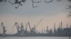 FILE - Harbor cranes are seen at the trade port in Mariupol, Ukraine, Feb. 23, 2022. Ukrainian ports in the Black Sea are major hubs for wheat and corn, but traffic in and out has ground to a halt due to Russia's invasion of Ukraine.