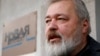 FILE - Russian investigative newspaper Novaya Gazeta's editor-in-chief Dmitry Muratov, one of the 2021 Nobel Peace Prize winners, speaks with journalists in Moscow, Russia, Oct. 8, 2021.