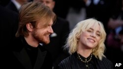 FILE - Finneas O'Connell, left, and Billie Eilish poses for photographers upon arrival for the World premiere of the new film from the James Bond franchise "No Time To Die," in London, on Sept. 28, 2021. They will perform a musical number at the 2022 Osca