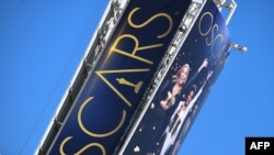 A sign announcing the upcoming Oscars Award show towers over Hollywood Boulevard, in Hollywood, California March 18, 2022. The 94th Academy Awards will take place on March 27, 2022.