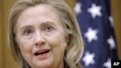 Secretary of State Hillary Clinton marks the State Department's observance of the first International Day of the Girl, at the State Department in Washington, October 10, 2012.