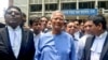 Bangladeshi Nobel laureate Muhammad Yunus, center, addresses the media at the Special Judge Court in Dhaka on June 12, 2024. Yunus was indicted in a corruption case, the latest charges to proceed against the respected economist that supporters say are politically motivated.