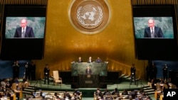 Russian President Vladimir Putin addresses participants of the 70th session of the United Nations General Assembly at U.N. headquarters in New York, Sept. 28, 2015.