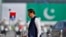 Pakistan's Prime Minister Imran Khan arrives to attend a military parade to mark Pakistan National Day in Islamabad, Pakistan, March 23, 2022. 