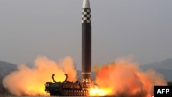 This picture released from North Korea's official Korean Central News Agency (KCNA) shows the test launch of what state media calls a new type inter-continental ballistic missile, the Hwasongpho-17 from an undisclosed location in North Korea, March 24, 2022.