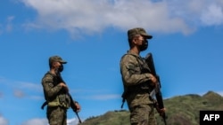 Philippine military officers stand by during a combined arms live fire exercise at the 37th Philippine-U.S. joint military exercises at Capas, Tarlac province, March 31, 2022.