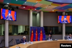 European Union foreign policy chief Josep Borrell and European Council President Charles Michel participate in a virtual EU China summit at the European Council building in Brussels, Belgium, April 1, 2022.