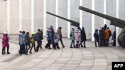 FILE - School children enter the Museum of the Great Patriotic War (also known as the Victory Museum ) - the largest museum of military history in Russia with the biggest collection of WWII military items - at Poklonnaya Hill in Moscow on March 17, 2022. 