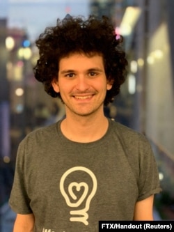 FILE - FTX CEO Sam Bankman-Fried poses for a picture in an unspecified location in this undated handout picture obtained by Reuters on July 5, 2022. (FTX/Handout via Reuters)