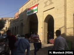 A sign outside Erbil's main bazaar urges residents to vote "yes" on the referendum for independence, in Erbil, Kurdish Iraq, Sept. 5, 2017.